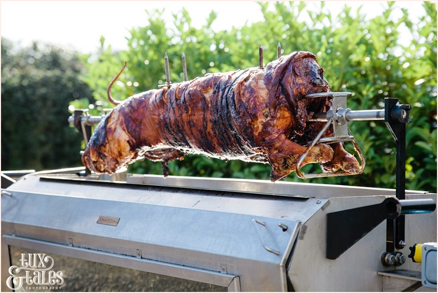 Wedding hog roast pig on spit
