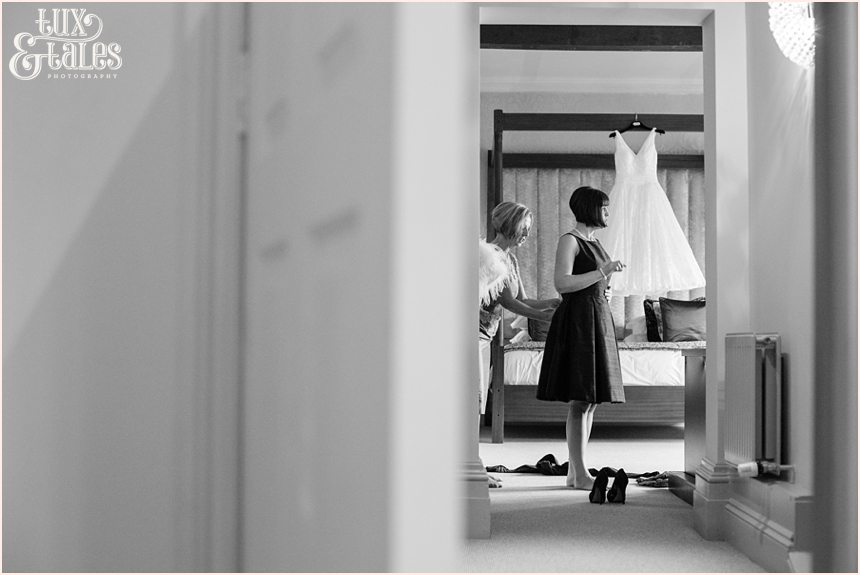 mother of the bride helps bridesmaid at hogarths hotel wedding