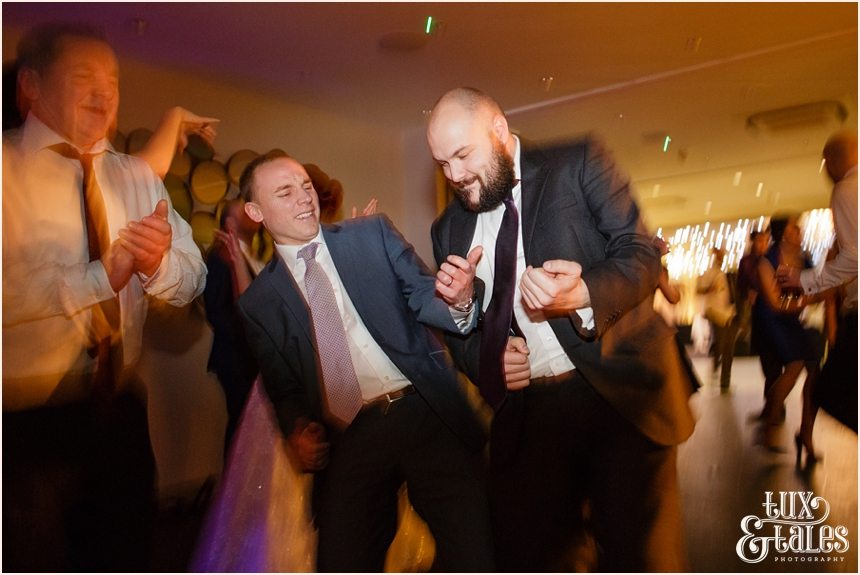 Guests doing air guitar at hogarths hotel wedding