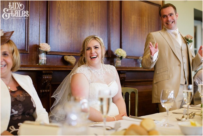 Bride laughs during speeches at The Alma Inn