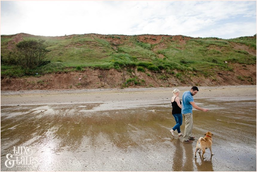 Engagement shoot at filey beach with dog puggle