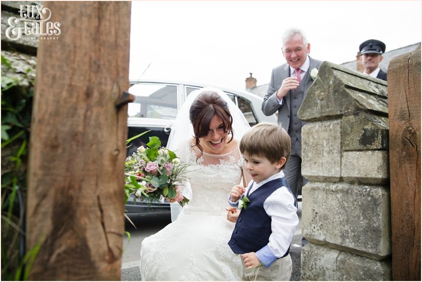 Bride greets son at escrick church wedding