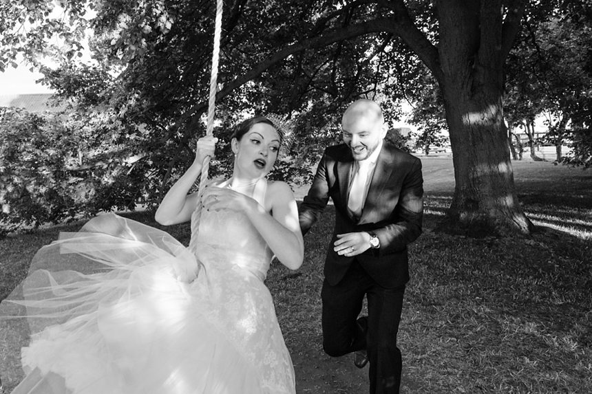 Barmbyfield Barn wedding photography swinging on swing