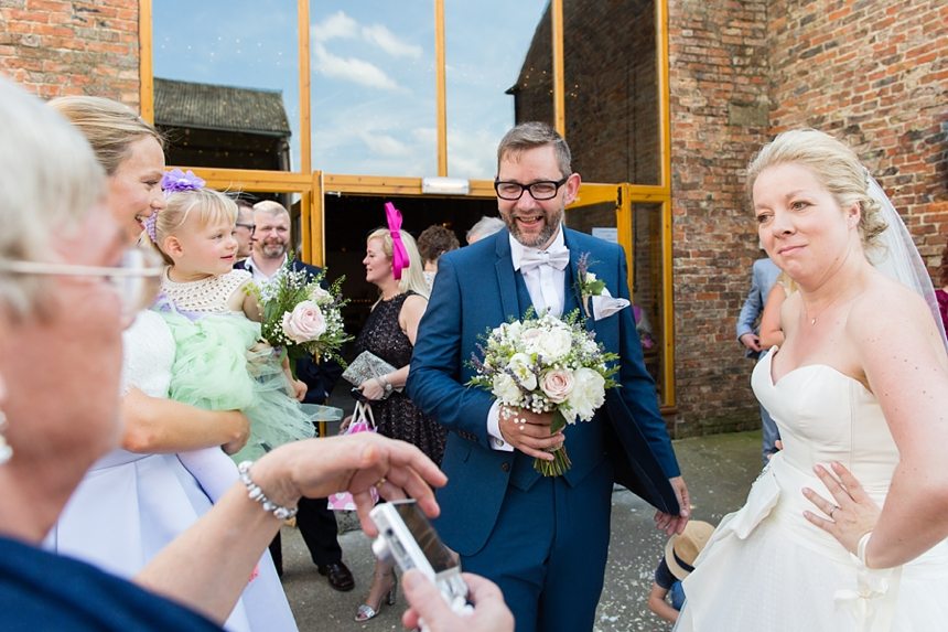 Canidid photographs at barmbyfiled barn wedding