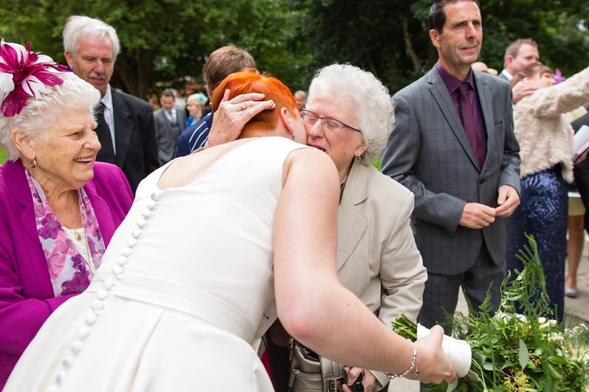 Leeds Club Wedding Photography Ceremony Candid Hug