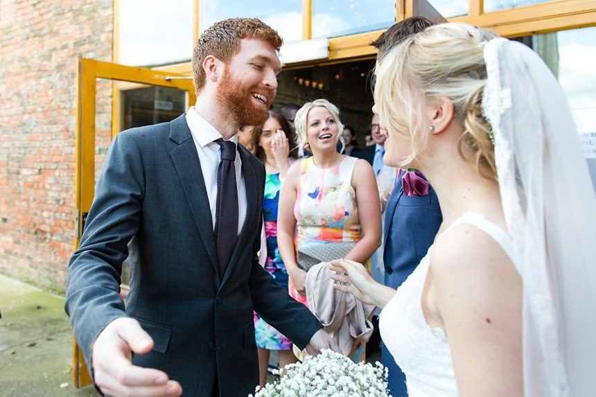 Candid hugs with guests Barmbyfield Barn Wedding