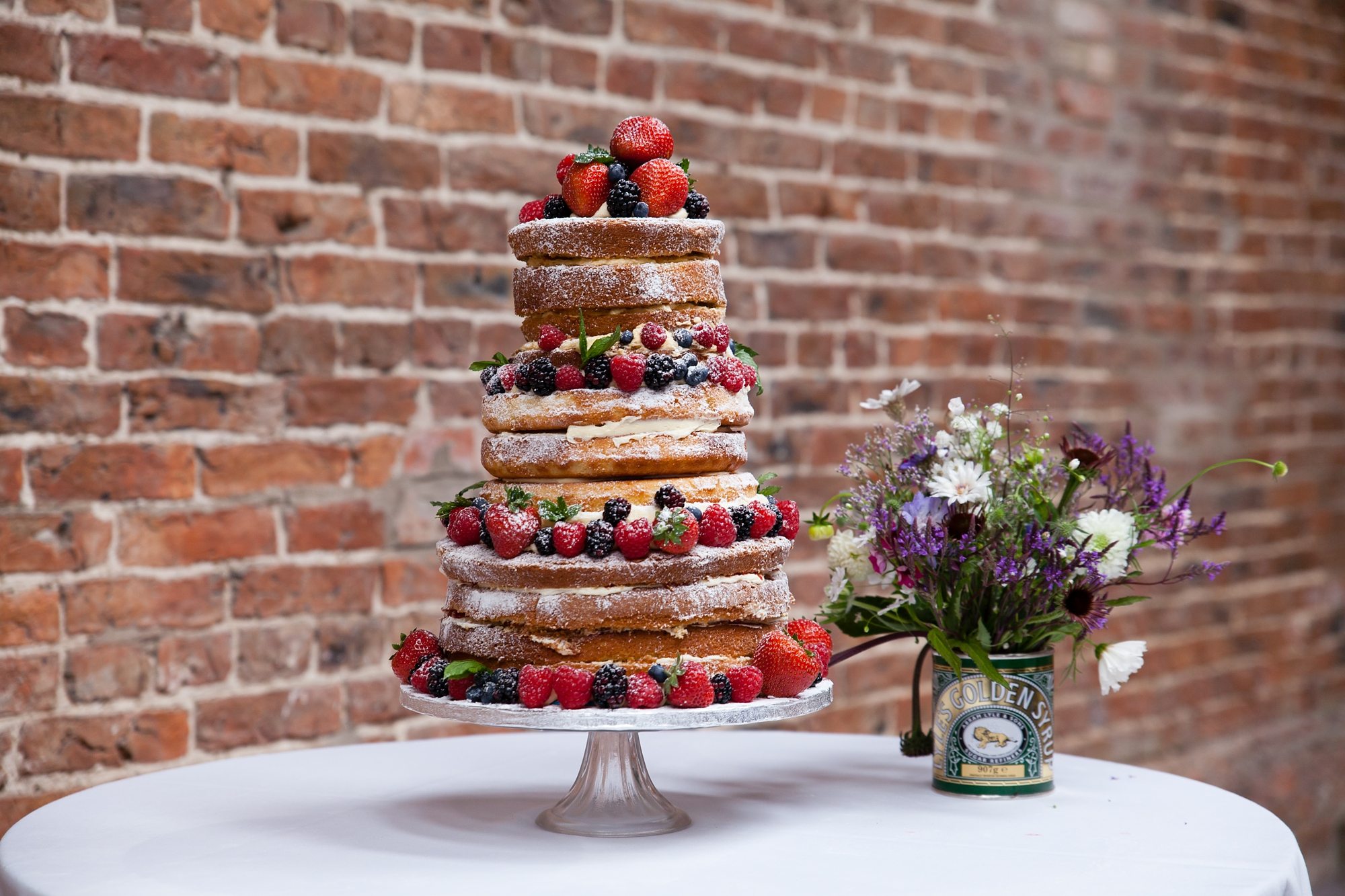 wedding cake with strawberries and blackberries and rasberries