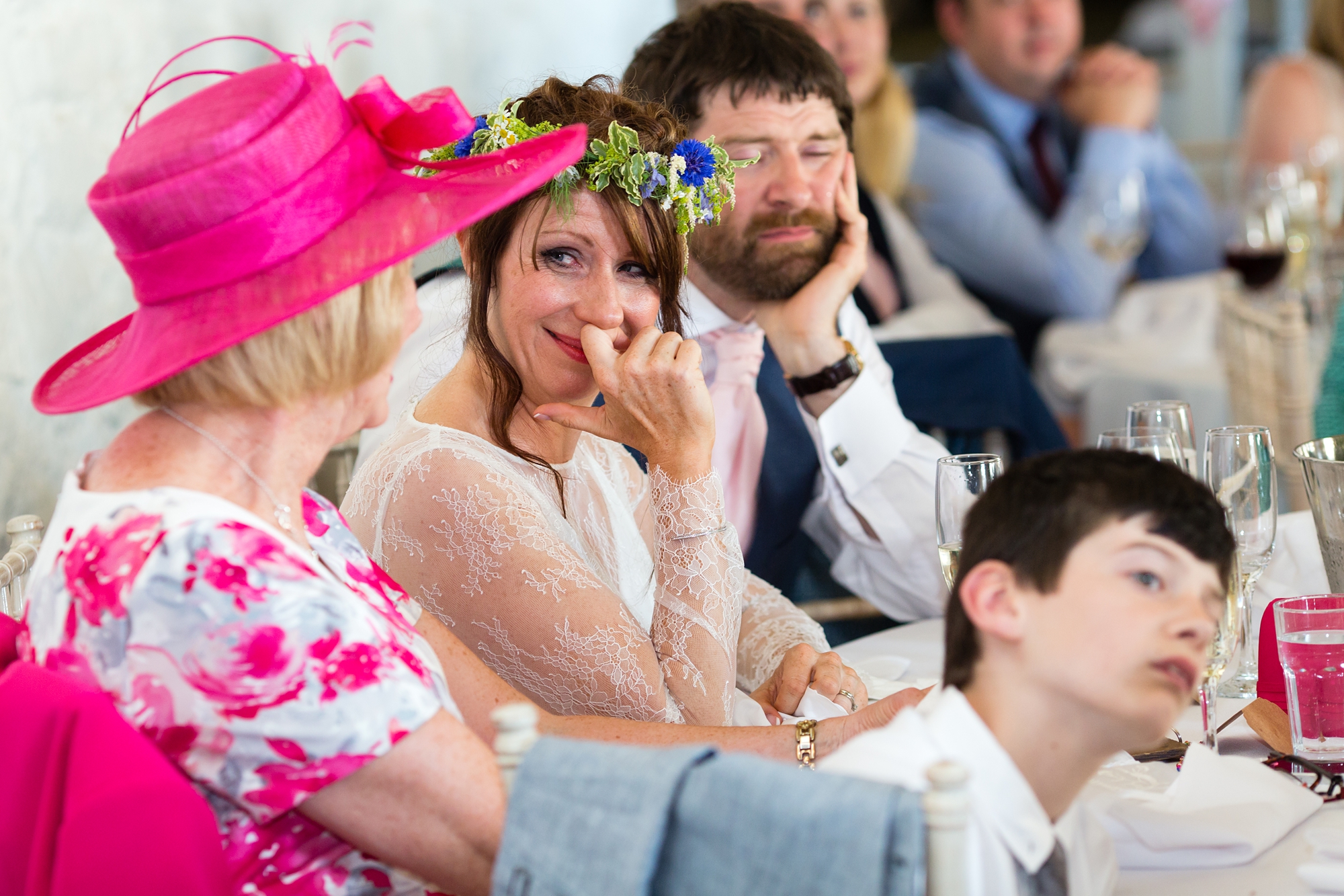 Bride smiles and cries during speeches