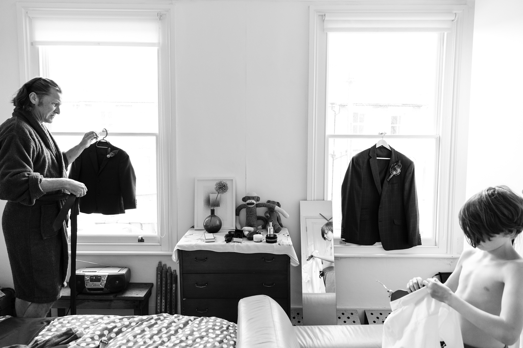 Quirky & fun wedding photography groom and son getting ready
