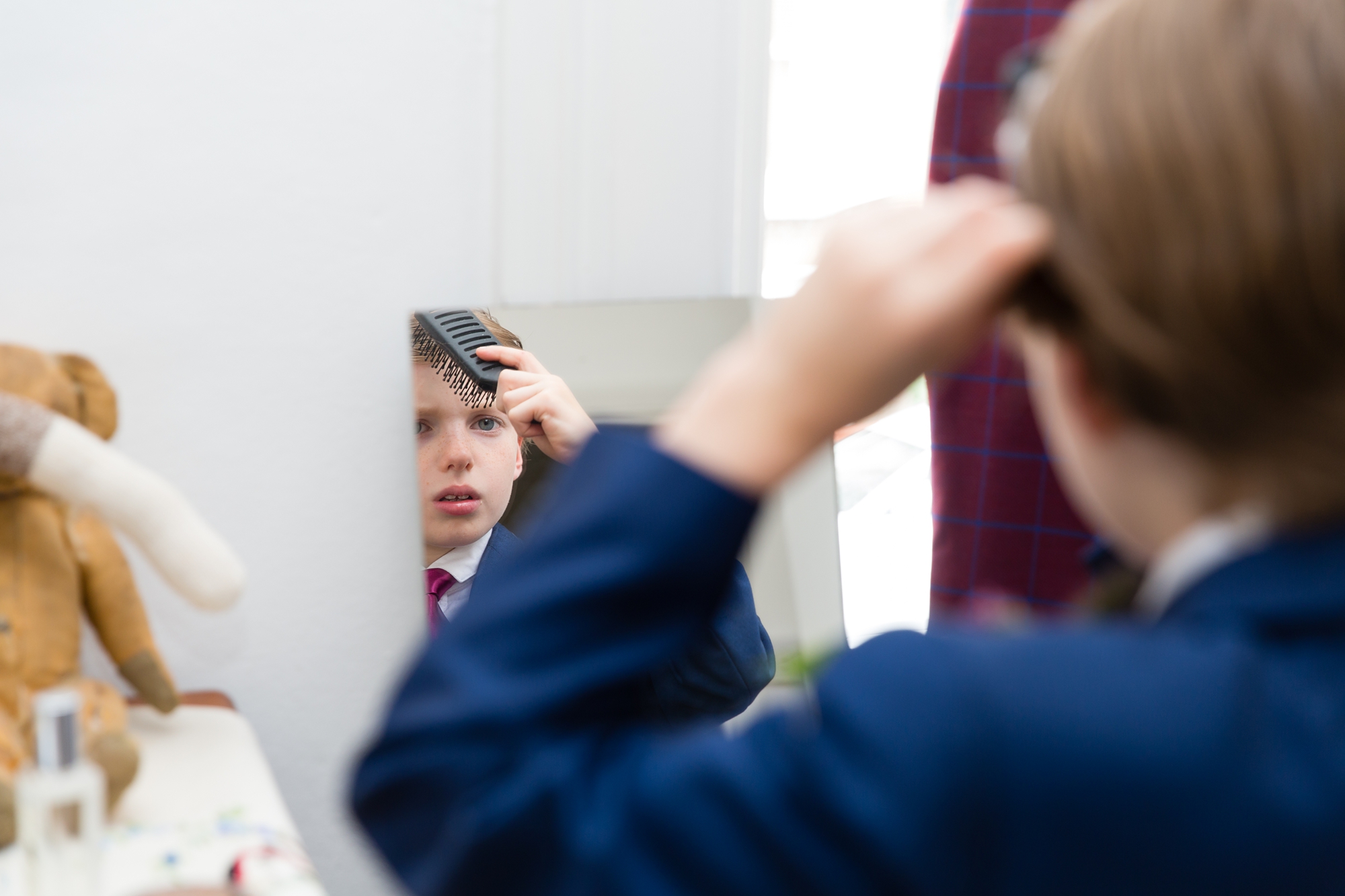 Groom's son brushing his hair