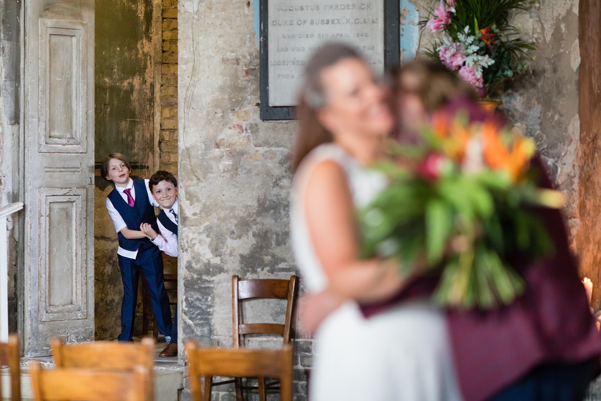 Little kids watch parents cuddle at London wedding at Asylum in London