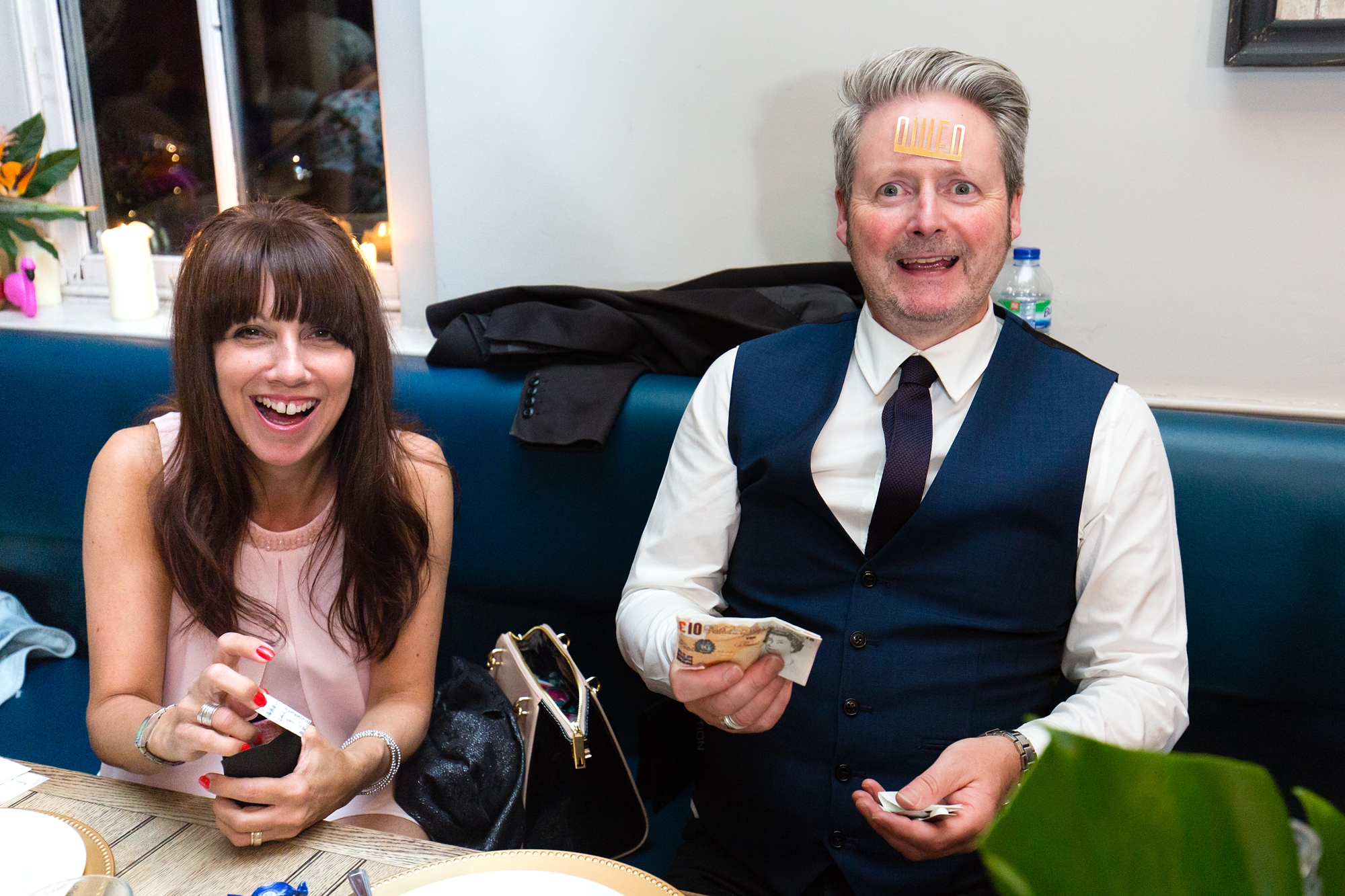 Funny guest wedding photo making a face with name stuck to forehead