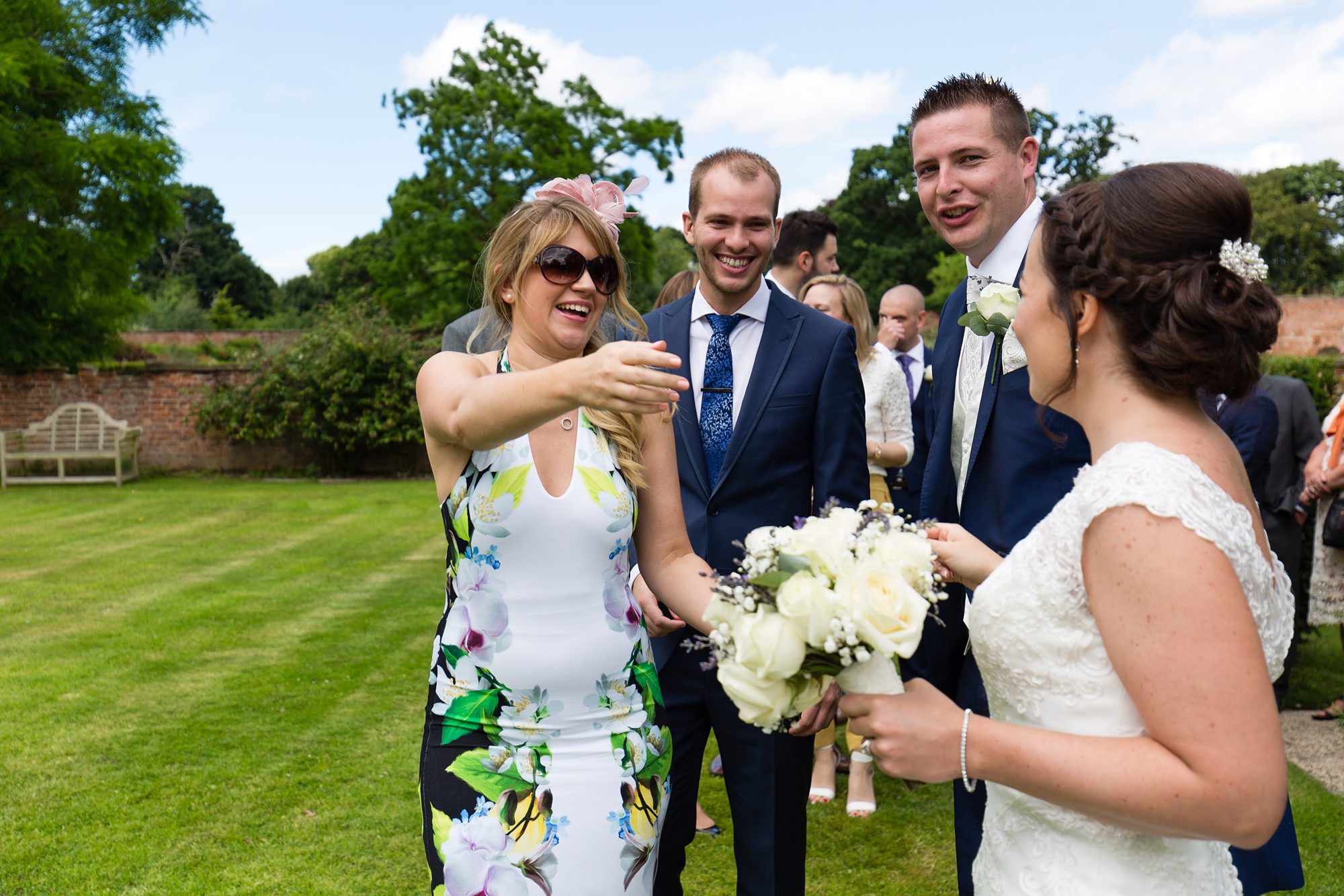 Bell Hall Wedding Photography guests hugging and saying hello to the couple. 