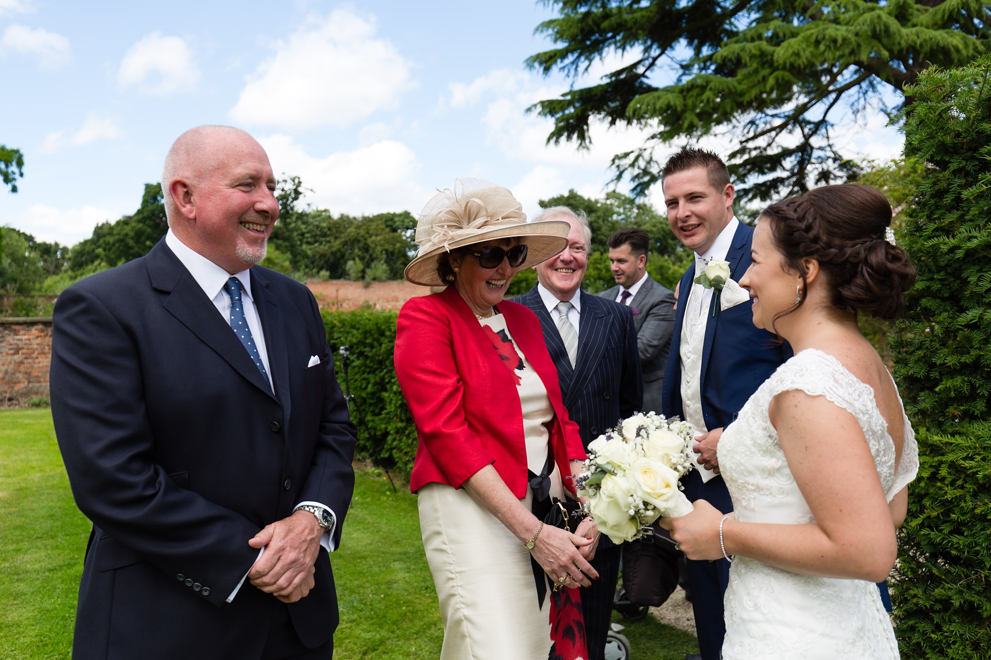 Bell Hall Wedding Photography guests hugging and saying hello to the couple. 