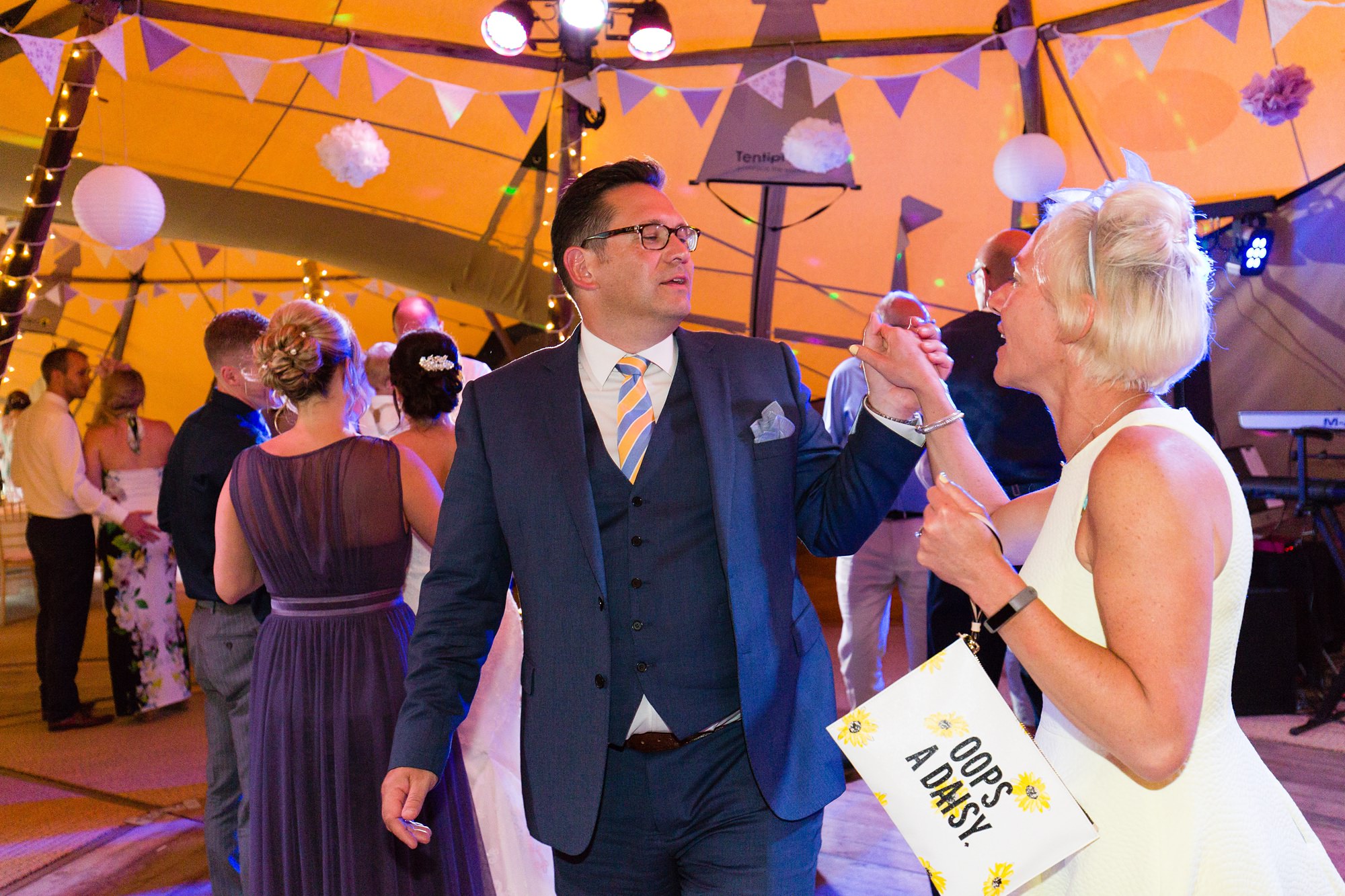 Guests dancing at tipi wedding