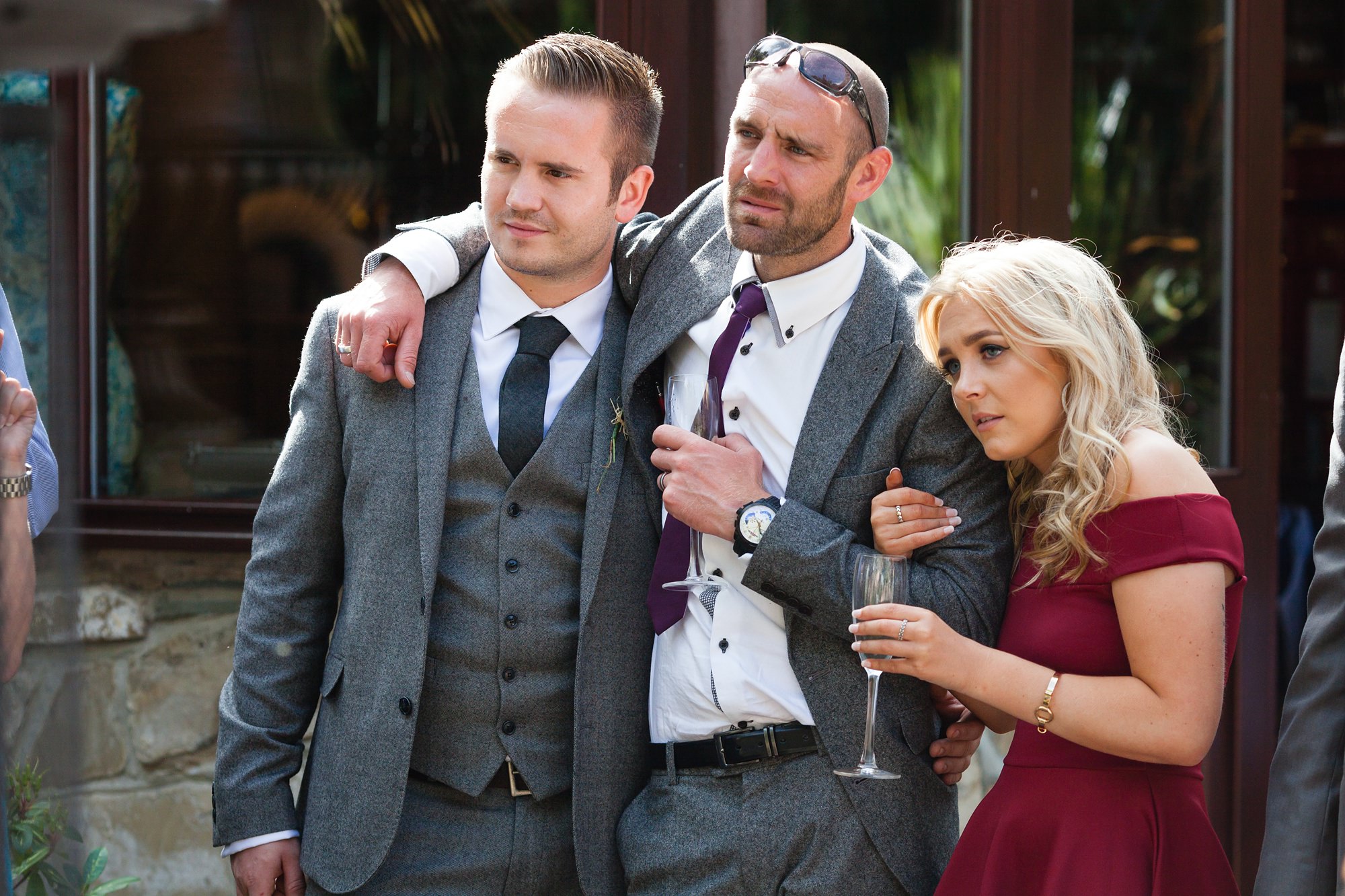 Guests hug during wedding