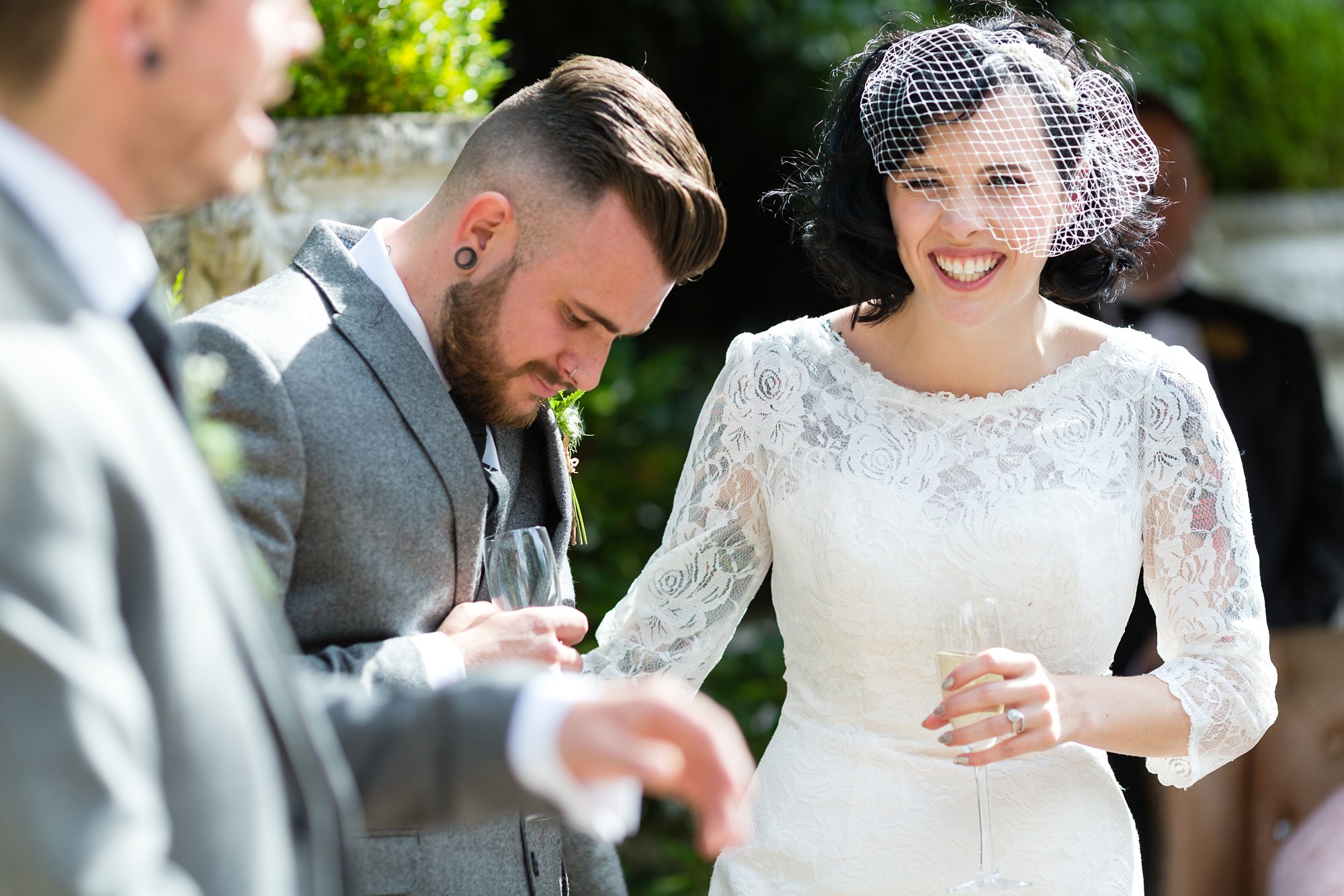 Bride and groom laughs during speeches