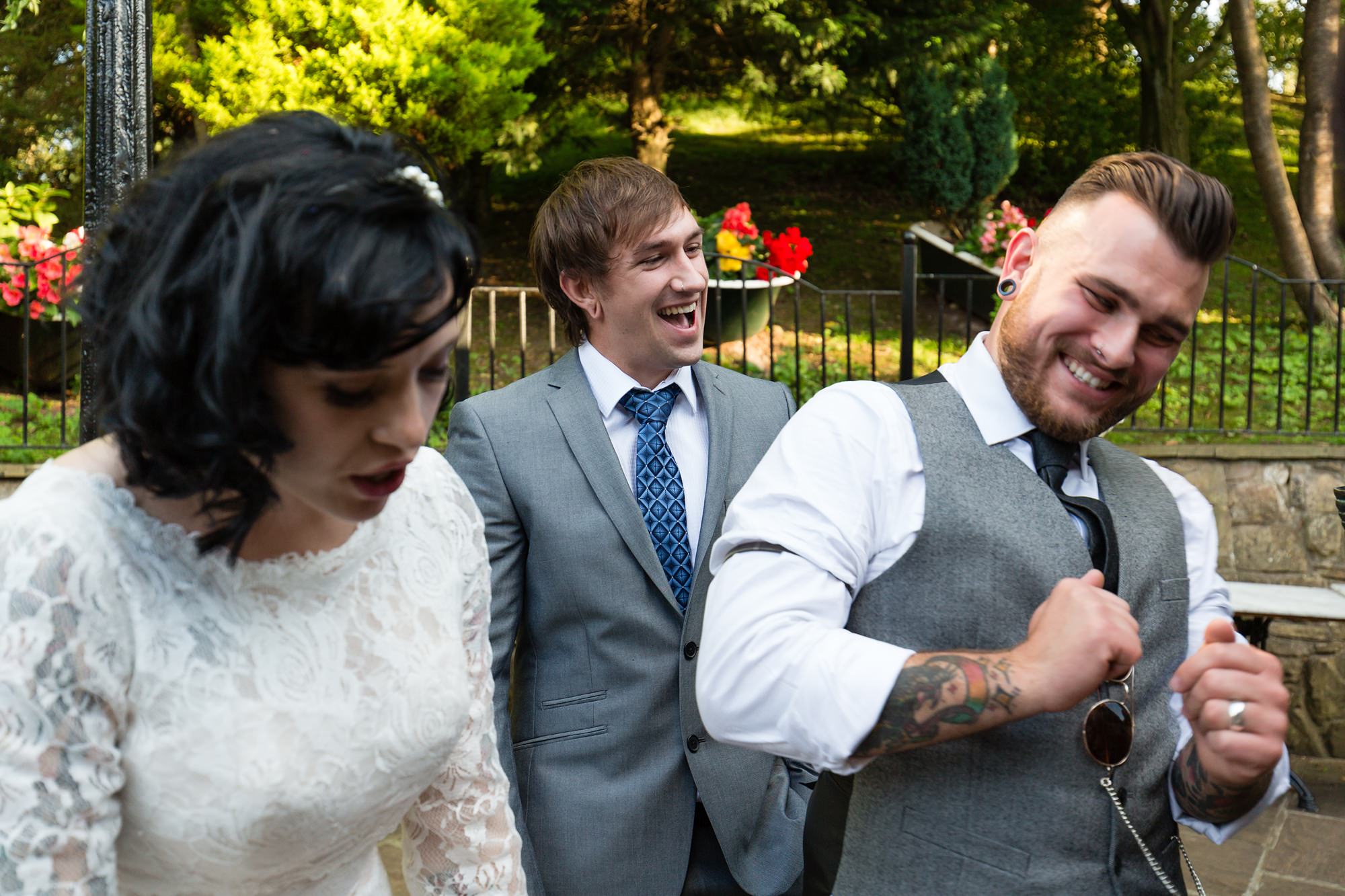 Guest laughs with brides and grooms Yorkshire Wedding Photography at Crab and Lobster
