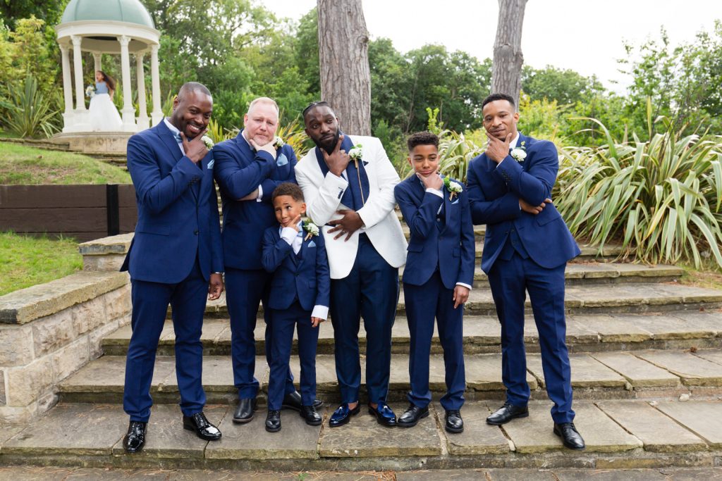 Groom and groomsmen make silly faces at rushpool hall hotel wedding