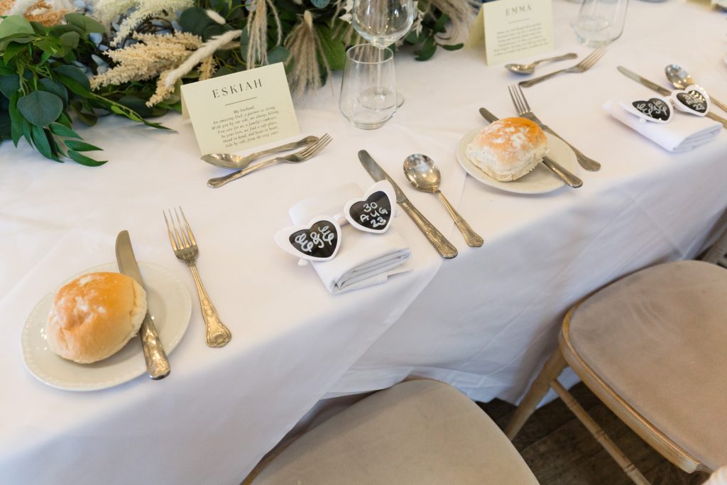 White heart sungglasses as table favours at Rushpool Hall wedding